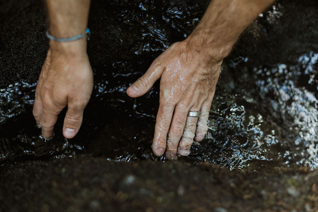 Hands in a stream